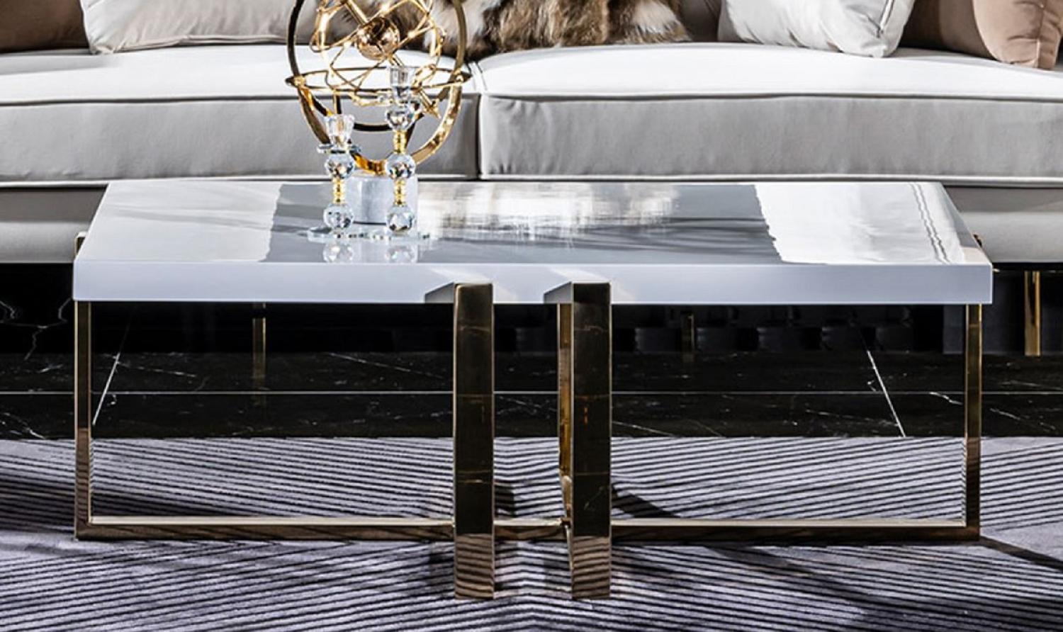 Casa Padrino Luxus Couchtisch Weiß / Gold 120 x 80 x H. 45 cm - Rechteckiger Wohnzimmertisch mit Massivholz Tischplatte und Metallbeinen - Wohnzimmer Möbel - Luxus Möbel - Hotel Möbel Bild 1