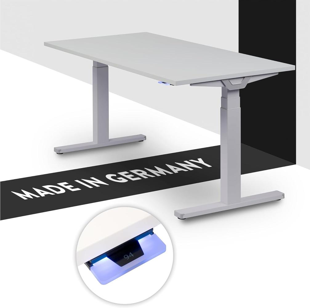 boho office® Premium Line - TÜV geprüfter, elektrisch stufenlos höhenverstellbarer Schreibtisch in Silber (RAL9006), inkl. Tischplatte in 140 x 80 cm in Lichtgrau (Melamin) Bild 1